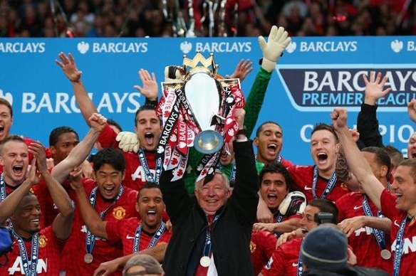 Sir Alex Ferguson lifts the Premier Trophy for the last time